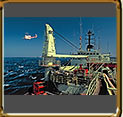 Helicopter to land on DSV ship in high seas. Bacia de Campos, Rio de Janeiro, Brazil.